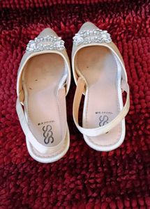 17. Elegant White Slingback Heels