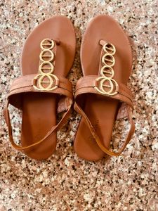 Stylish Brown T-Strap Sandals with Gold Accents