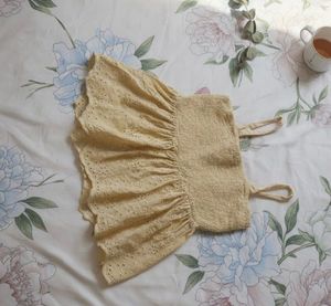 Smocked Eyelet Peplum Top