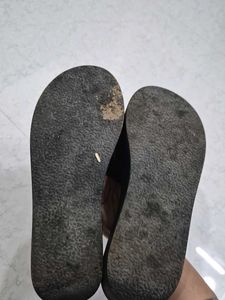 Stylish Black Slip-On Sandals with Gold Accent