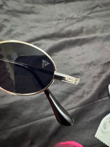 voyage black oval unisex sunglasses
