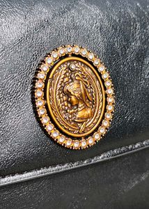 Chic Black Handbag with Gold Embellishment