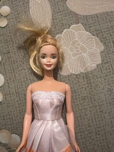 leo Barbie Doll with Pink Dress