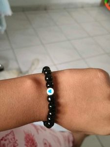 Black Beaded Bracelet with Blue Heart Charm