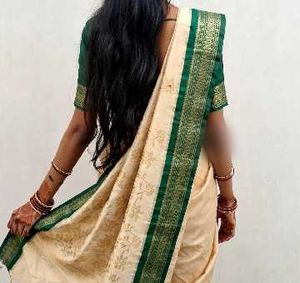 Elegant Beige Saree with Green Border