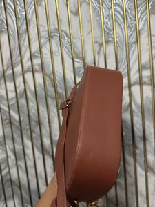 Chic Brown Handbag with Gold Chain Strap