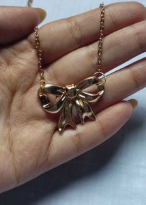 Gold Tone Bow Necklace