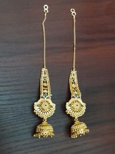 Gold Jhumka Earrings with Green Stones