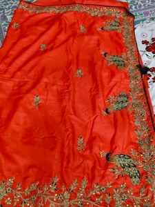 Vibrant Orange Saree with Peacock Embroidery