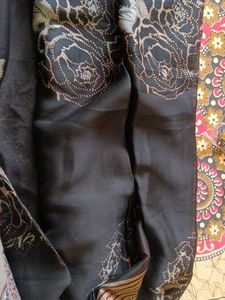 black golden and red colour saree