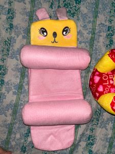 infant pillow and a teddy bear