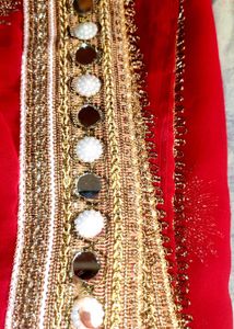 Red saree with mirror work border