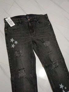 Distressed Black Jeans with Star Detail