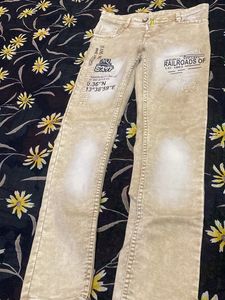 Stylish Beige Jeans with Graphic Print
