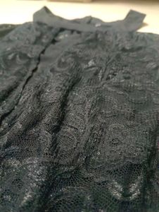 Black halter neck top.