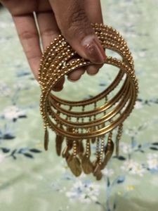 Elegant Gold-Toned Bangle Set with Leaf Charms