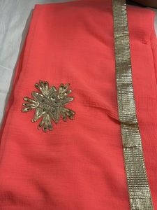 Stunning Coral Saree with Gold Border