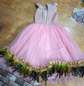 Sparkling Pink Tulle Gown with Feather Trim
