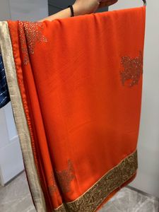 Vibrant Orange Embellished Saree with velvet blous