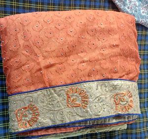 Orange Cream saree with blouse and peticoat