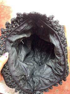 Handmade cord handbag in wooden handle