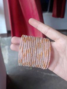 I am selling my beautiful peach bangles