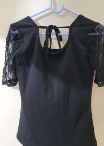 Black Top With Sheer Sleeves And Back Knot