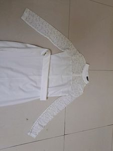 White dress with lace detailing. Belt not available