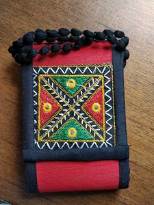 Embroidered sling bag