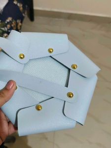 Chic Light Blue Handbag with Scarf Detail