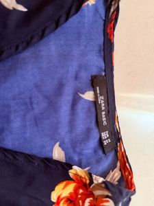 Navy Floral Wrap Top with Ruffled Sleeves