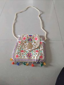 Embroidered Clutch Bag with Tassels