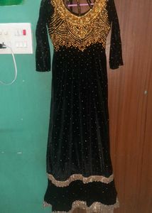 Elegant Black Velvet Gown with Gold Embellishments