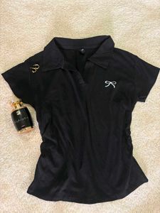 Chic Black Polo Shirt with Bow Detail