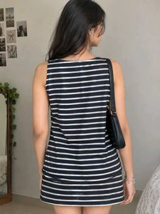 Chic Grey Sleeveless Top with Embellished Neckline