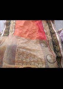 Exquisite Peach and Gold Net Saree