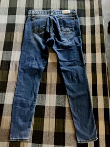Distressed Blue Denim Jeans
