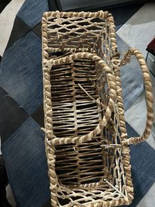Woven basket on a metal frame