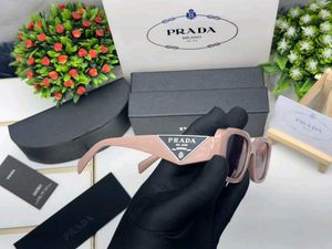 Prada Sunglasses - Chic Pink Tinted Lenses