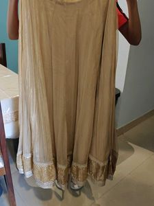 Elegant Beige Skirt with Embellished Hem