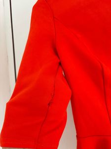 Vibrant Orange Peplum Top