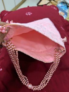 pink embroiderd party  potli bag absolutely new