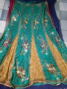 Embellished Teal lehenga Saree with Floral Motifs