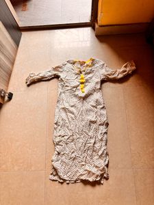 Elegant Cream Kurta with Yellow Tassels