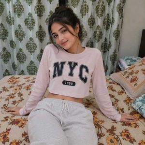 Pink NYC Cropped Long Sleeve Top