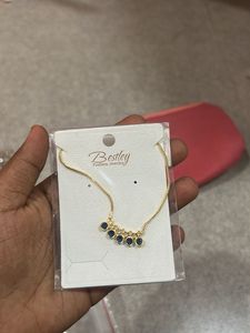 Elegant Gold Necklace with Blue Stones