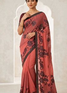 Elegant Coral Saree with Black Floral Print