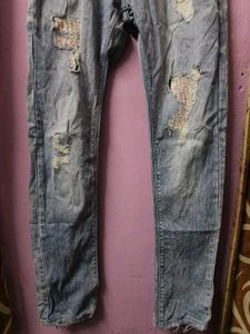 Distressed Light Wash Denim Jeans