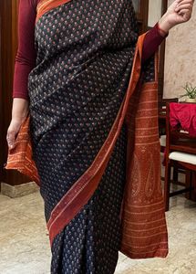 Elegant Black Saree with Orange Border