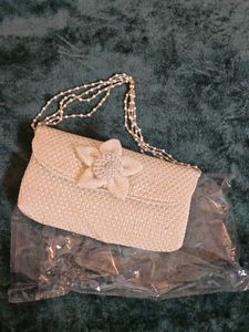 Elegant Woven Clutch with Pearl Strap
